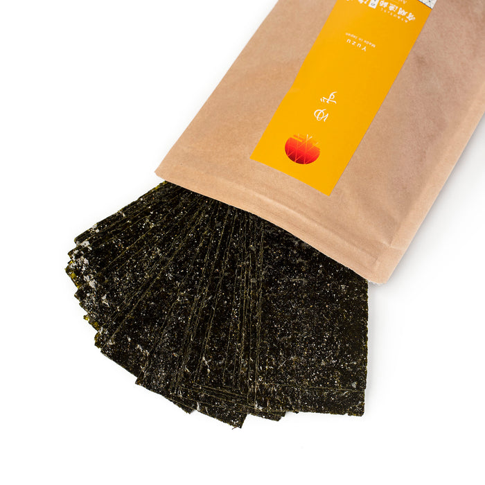 Nori snacks popping out of a bag of the product