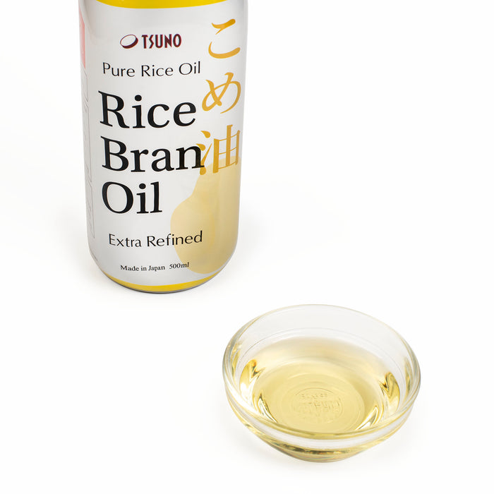 A bowl of Pure Rice Bran Oil next to the package bottle
