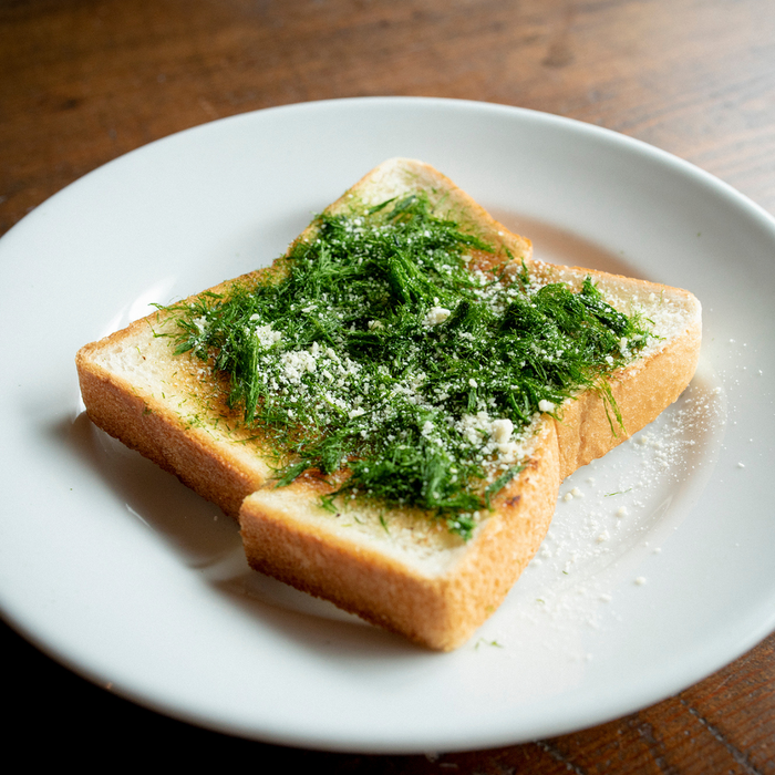 A toast topped with dried aonori and cheese