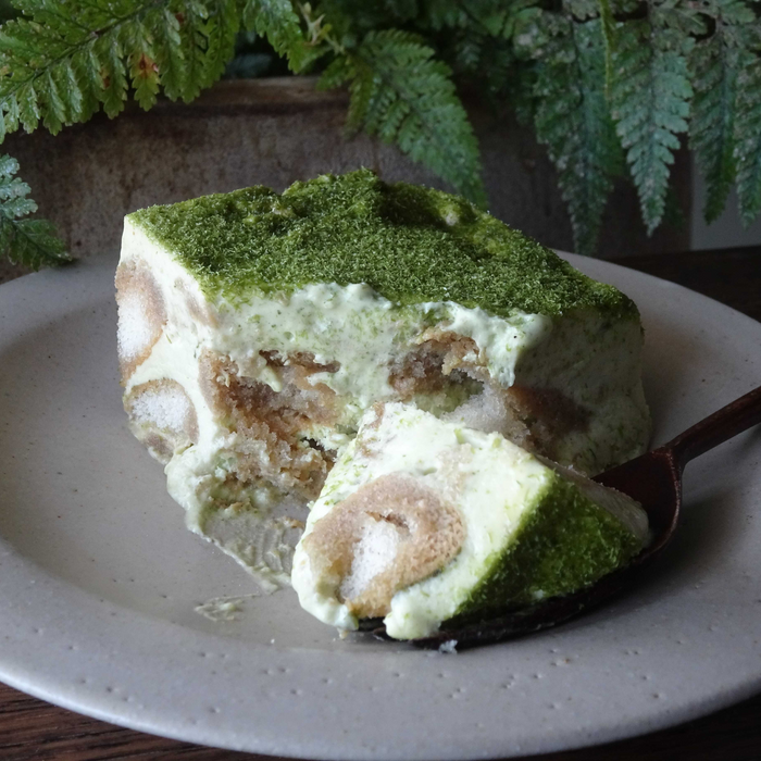 A plate of cake topped with dried aonori