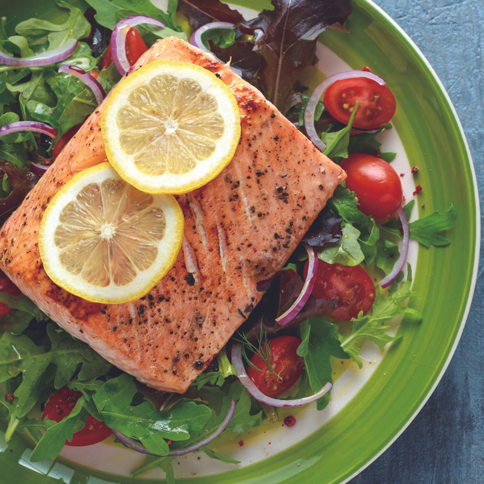 A plate of grilled salmon with shiso EVOO sauce