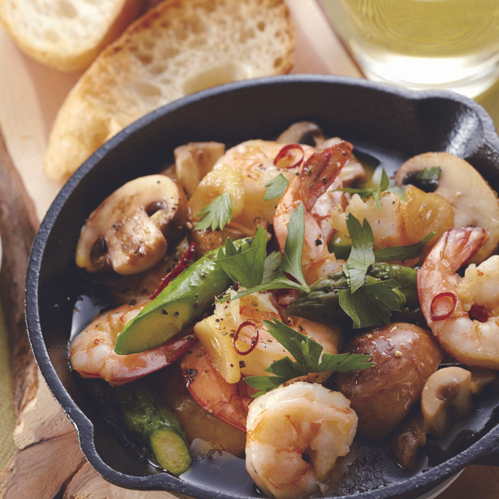 A pan of ajillo with shiso EVOO sauce
