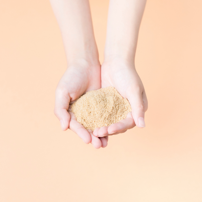Hands holding rice bran