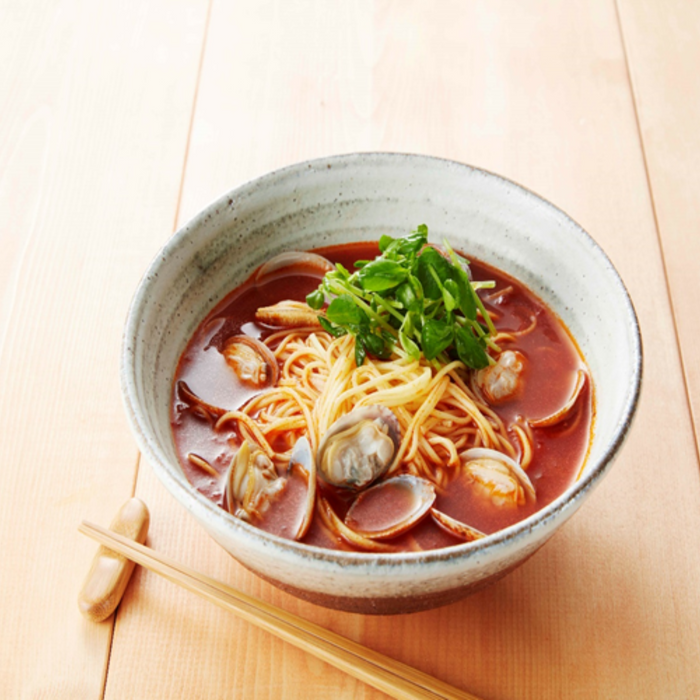 A ramen bowl with red soup