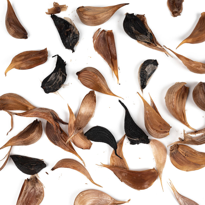 Scattered black garlic cloves