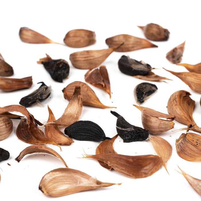 Scattered black garlic cloves