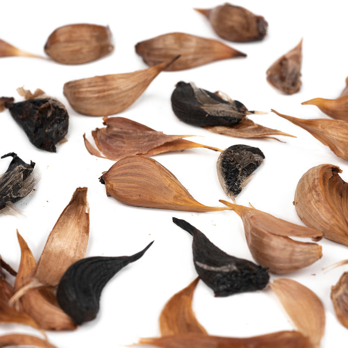 Scattered black garlic cloves