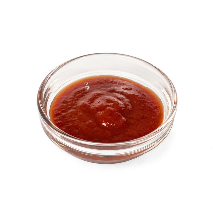 A bowl of ketchup