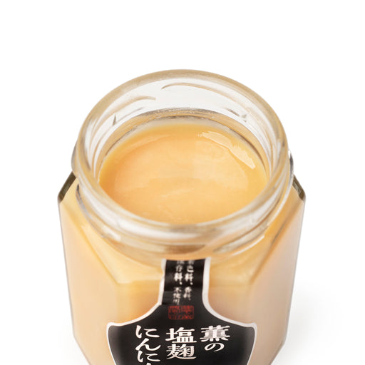 An opened jar of the product