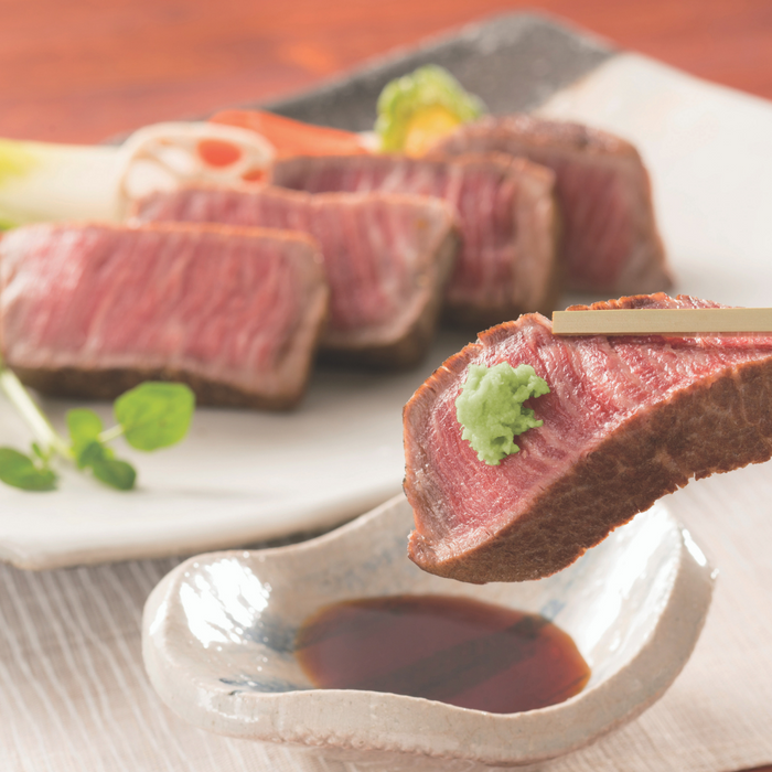 A slice of beef steak topped with hon wasabi