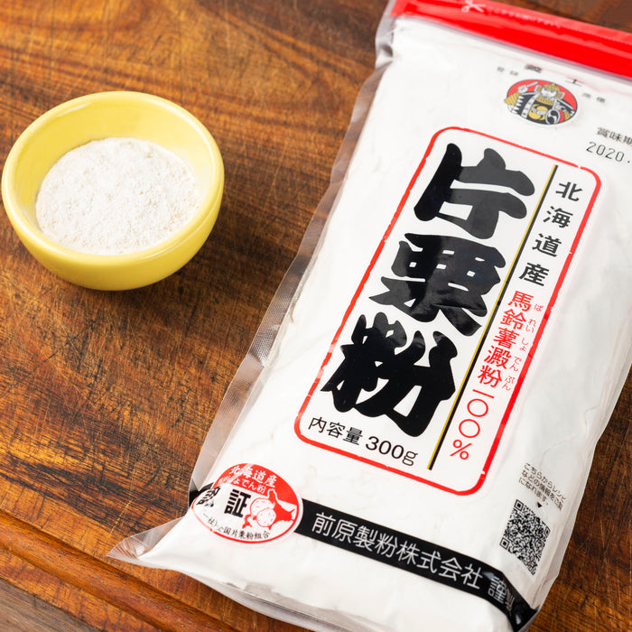 A bowl of katakuri powder next to package of the product