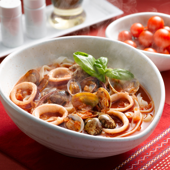 A bowl of kishimen noodles with seafood soup