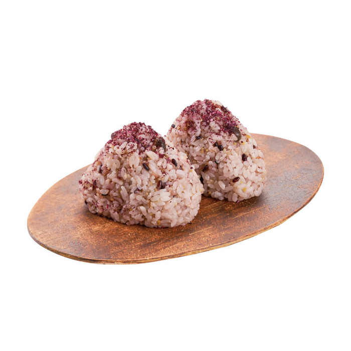 A plate of two onigiri rice balls topped with organic shiso furikake