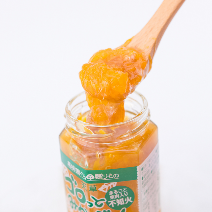 Man taking sumo citrus preserve with spoon