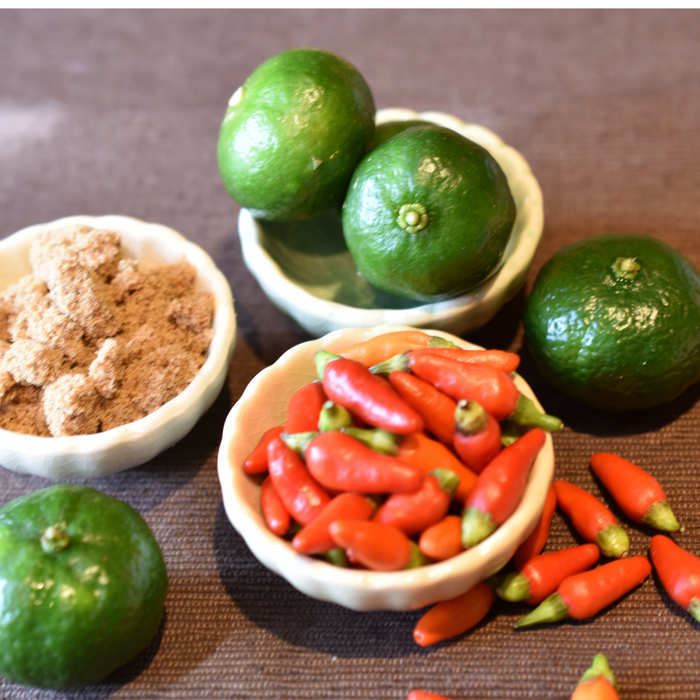 Four shikuwasa citruses and a bunch of chili peppers