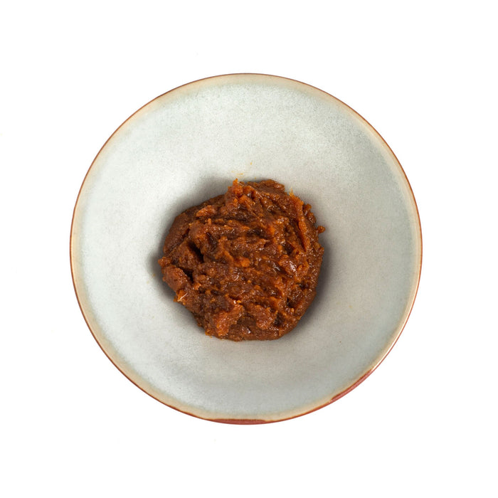 Overhead shot of small bowl of two year fermented miso