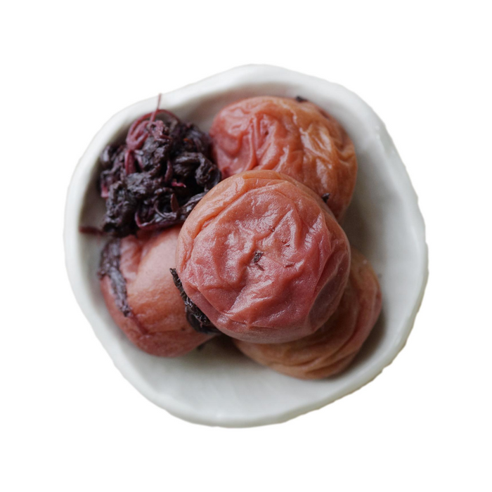 Overhead angle of four pieces organic umeboshi  on small bowl