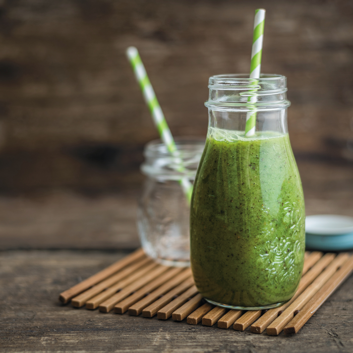 A glass of iced mulberry matcha green tea