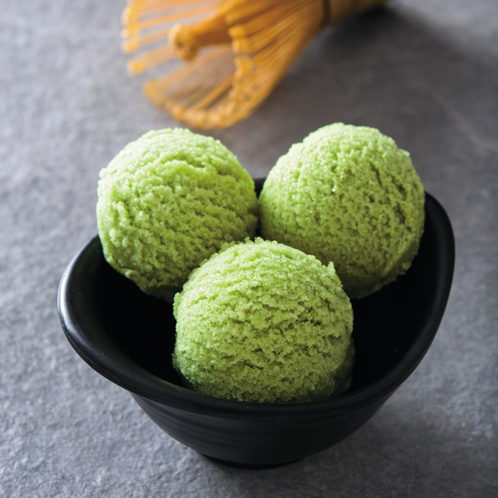 A bowl of three scoops of mulberry matcha ice cream