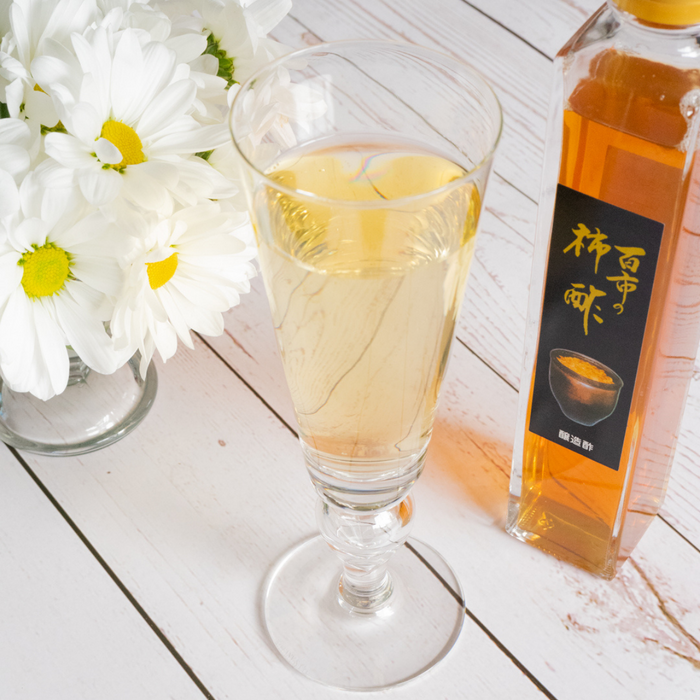 A glass of persimmon vinegar blended sparkling water