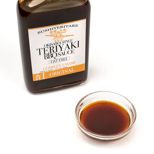 A bowl of the teriyaki sauce next to package bottle