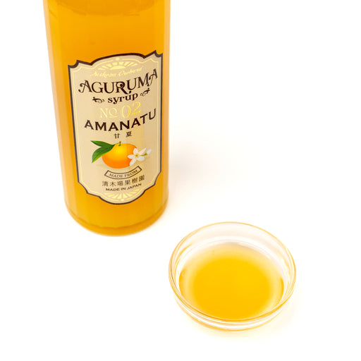 A bowl of amanatsu syrup next to a package bottle