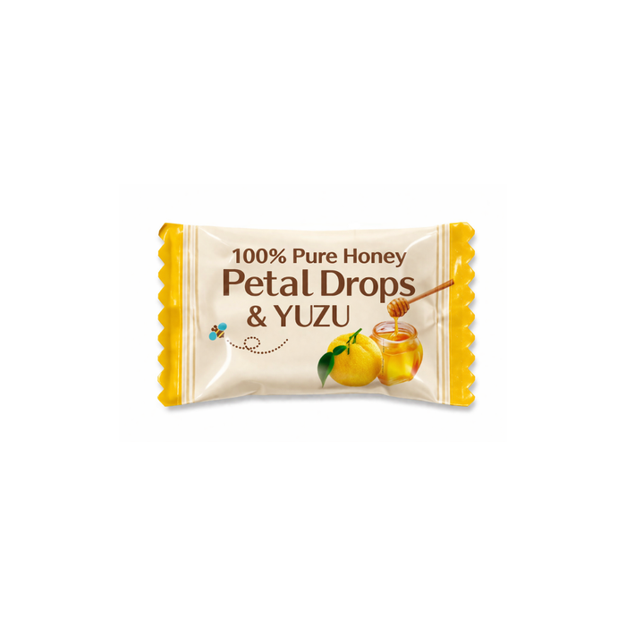 An individual  package of a honey & yuzu drop