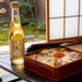 A bottle of sushi vinegar and chirashi sushi 