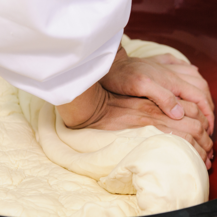 Man kneading udon dough