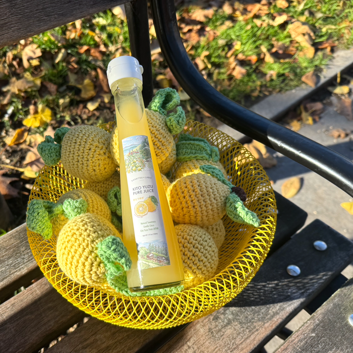 A package bottle of the yuzu extract on a bowl