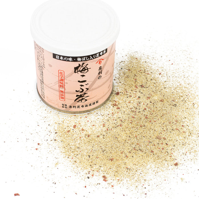 Scattered ume kombu seasoning next to a bottle of the product