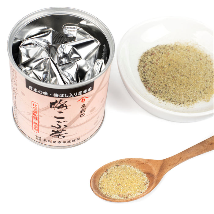 A spoon and a bowl of ume kombu seasoning next to a bottle of the product