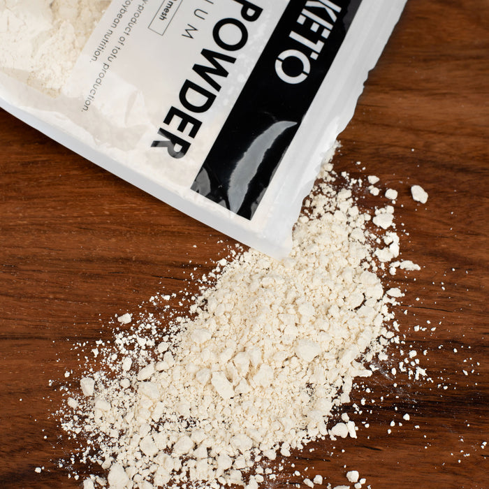 Okara powder popping out of a package bag of the product