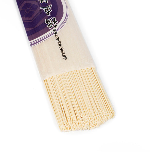 Inaniwa udon noodles popping out of package bag of the product