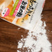 Scattered rice flour on cutting board