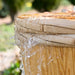 Spring water gushing out through wooden barrell