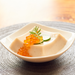 A bowl of sesame tofu topped with salmon roe