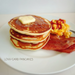 A plate of pancakes, bacon and scramble egg