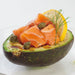 salmon sashimi and caper on avocado drizzled with wasabi olive oil