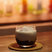 A glass of black sesame latte blended cocktail