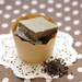 A paper cup of black sesame chocolate bars
