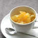 A cup of fresh grape fruits topped with organic yuzu spread