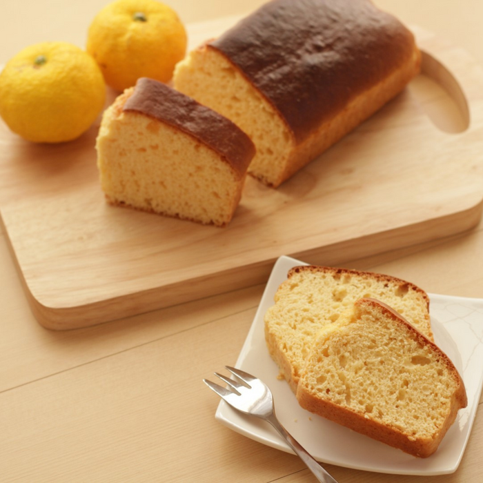 A plate of two slices of yuzu cake